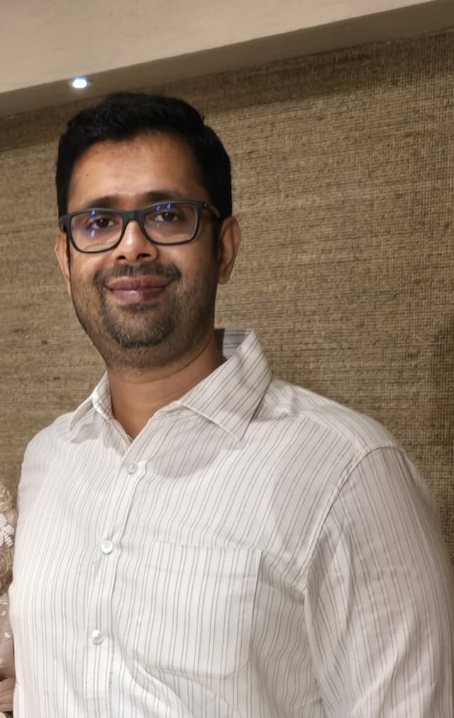 Dr Cyriac P J in a clinical setting